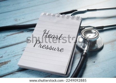 Heart Pressure wording on a paper with stethoscopes. Medical concept. 