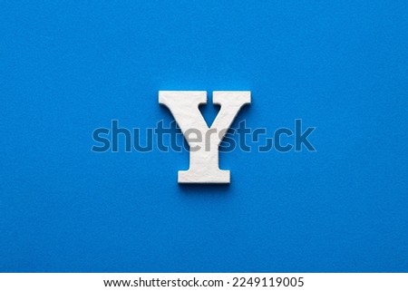 Letter Y uppercase - White wood font on blue foamy background