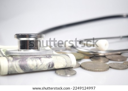 Selective focus image of stethoscope and money. Medical and business concepts 