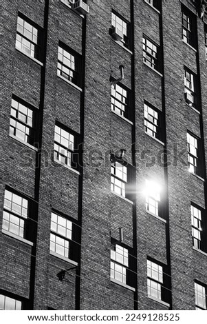 Abstract Image of Brick Building Windows With Reflection