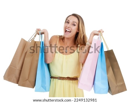 Shopping bag, portrait and woman excited in studio, isolated white background and retail mall sales. Happy customer, model and shopping in commerce market, discount promotion and luxury store brand