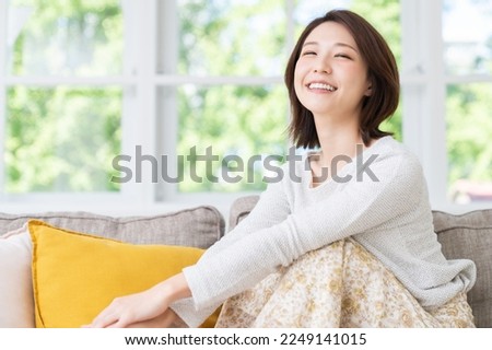 young attractive asian woman relaxing Royalty-Free Stock Photo #2249141015