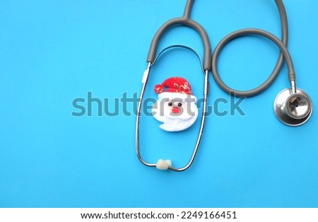stethoscope and santa claus isolate on a blue background. christmas and new year.top view, flat lay, copy space.horizontal photo