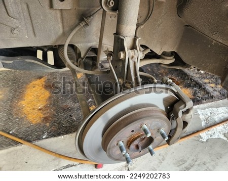 Close up of car disk breaker during maintenance
