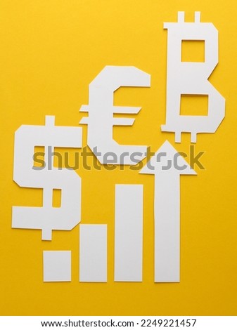 Paper-cut columns of a chart tending upwards and different currencies symbols on yellow background. Analytics, business concept
