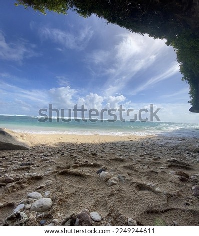 cave close to the sea with blue clouds