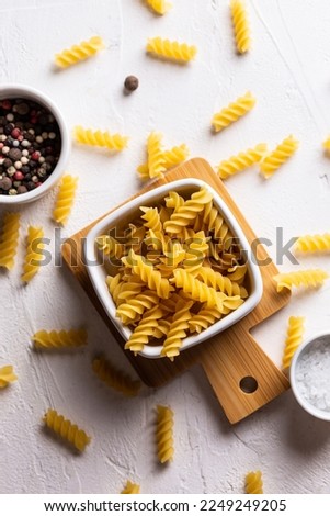 Uncooked pasta in a bowl Royalty-Free Stock Photo #2249249205