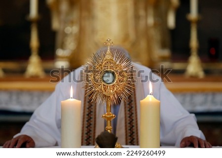 The Blessed Sacrament in a monstrance. Eucharist adoration. France. Royalty-Free Stock Photo #2249260499