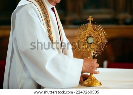 The Blessed Sacrament in a monstrance. Eucharist adoration. France. Royalty-Free Stock Photo #2249260505