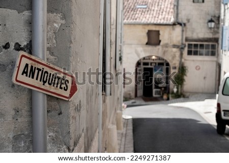 French antique signage on rustic street