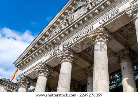 The Reichstag building (Bundestag) in Berlin, Germany, meeting place of the German parliament: The inscription says: Dem Deutschen Volke - To the German people Royalty-Free Stock Photo #2249276359