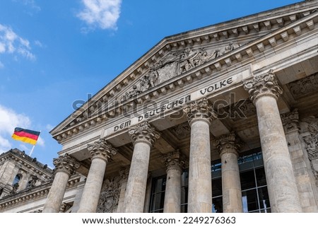 The Reichstag building (Bundestag) in Berlin, Germany, meeting place of the German parliament: The inscription says: Dem Deutschen Volke - To the German people Royalty-Free Stock Photo #2249276363