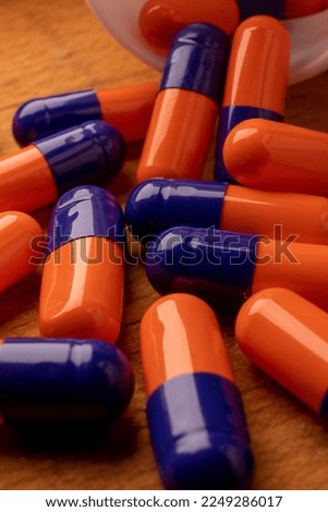 A picture of blue and orange pills, symbolizing the power of nature in providing healing and treatment.