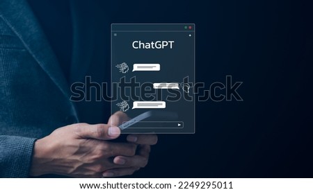 ChatGPT Chat with AI or Artificial Intelligence technology. businessman using smartphone chatting with intelligent artificial intelligence. Developed by OpenAI. Futuristic technology. automate chatbot Royalty-Free Stock Photo #2249295011