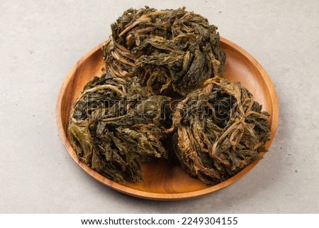 Dried radish or cabbage leaves. Weave, dry, and store together Royalty-Free Stock Photo #2249304155