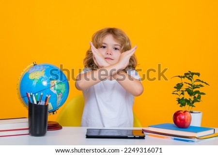 Stop bullying. Sad and angry pupil. School child student learning in class, study english language at school. Elementary school child. Portrait of funny pupil learning.
