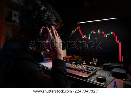 Stress Business man look at the Computer Monitor Screen shows the financial market chart graphic going down. Stock market concept.
red candlesticks going down without resistance, market crash, bear ma
