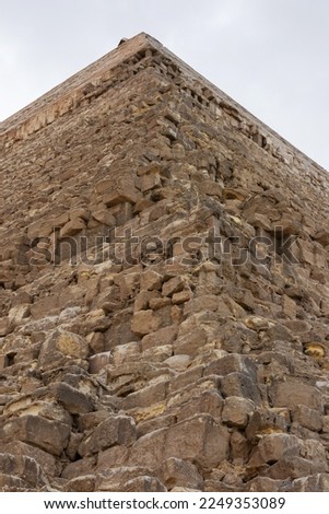 Edge of the pyramid of Khafre or of Chephren the second-tallest and second-largest of the 3 Ancient Egyptian Pyramids of Giza and the tomb of the Fourth-Dynasty pharaoh Khafre (Chefren) Royalty-Free Stock Photo #2249353089