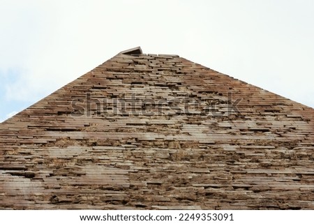 Tiled top of the pyramid of Khafre or of Chephren the second-tallest and second-largest of the 3 Ancient Egyptian Pyramids of Giza and the tomb of the Fourth-Dynasty pharaoh Khafre (Chefren) Royalty-Free Stock Photo #2249353091