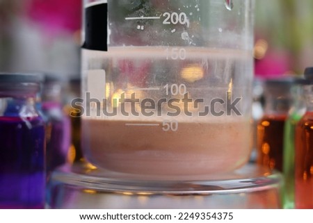 Preparation of a brown insoluble substance of manganese sulfide in a beaker. Royalty-Free Stock Photo #2249354375