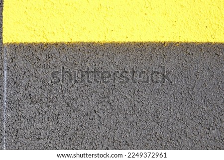 New yellow line painting on paving texture