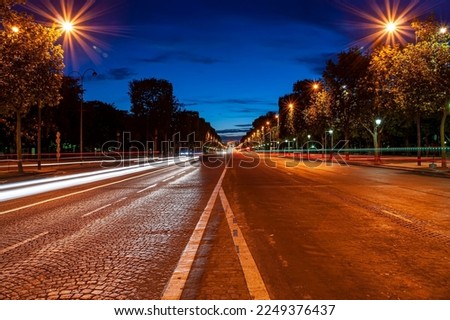 Champs-Elysees avenue at night with the Triumphal Arch in the background, Paris, France Royalty-Free Stock Photo #2249376437