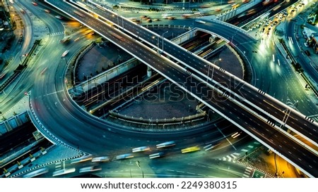 Expressway top view, Road traffic an important infrastructure, Drone aerial view fly in circle, traffic transportation, Public transport or commuter city life concept of economic and energ, transport. Royalty-Free Stock Photo #2249380315