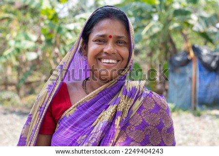 Portrait of a Indian rural woman smiling Royalty-Free Stock Photo #2249404243
