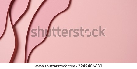 Abstract colored paper texture background. Minimal paper cut composition with layers of geometric shapes and lines in pastel pink colors. Top view, copy space Royalty-Free Stock Photo #2249406639