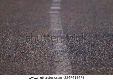 Road markings on the asphalt close-up.
