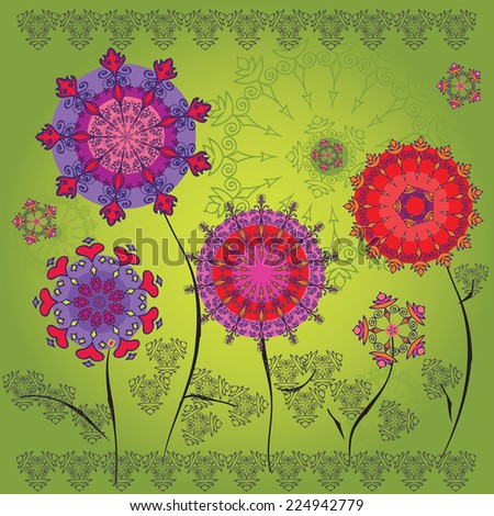 Colored mandala flowers on a green background