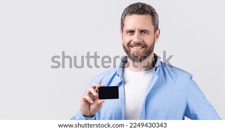 happy man with business debit in studio. man holding business debit. photo of man