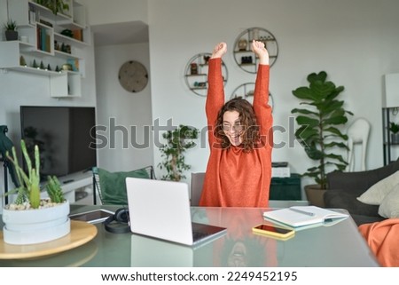 Young excited happy woman student winner success using computer laptop winning online at home, celebrating great exam results or new job opportunity receiving email with approval concept. Royalty-Free Stock Photo #2249452195