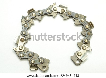Vintage Metal chain for chainsaw on gray background