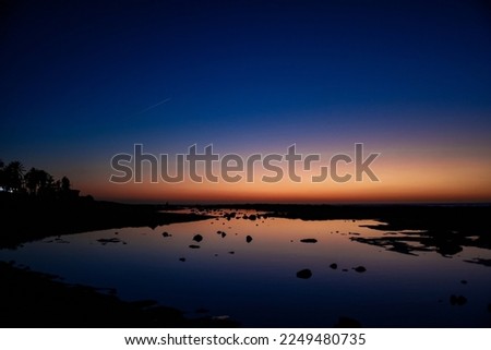 Sea and sun at sunset, orange sunset, blue sea night photo, stars and nature