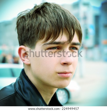 Toned Photo of Sad Teenager Portrait on the City Street
