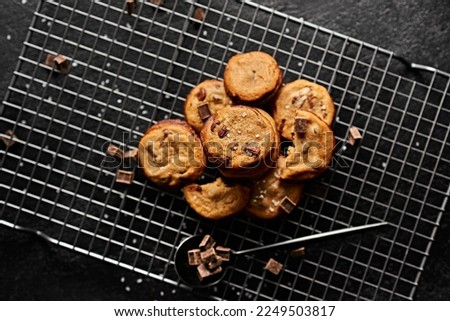 Chocolate Chip Cookies, Dark, Black Background. High resolution photography. Website image