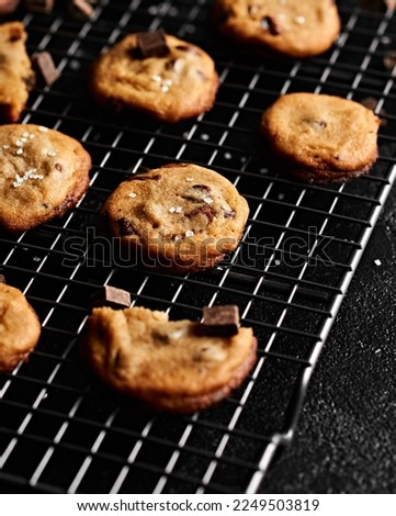Chocolate Chip Cookies, Dark, Black Background. High resolution photography. Website image