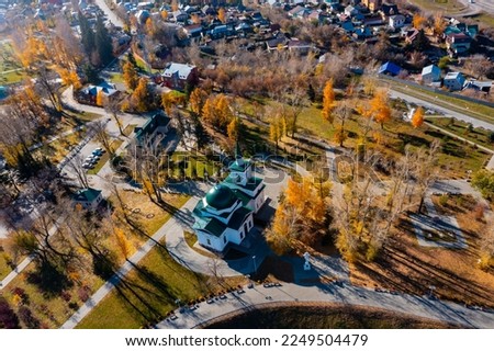 drone view of city with houses, roads, urban infrastructure, Barnaul, sunny autumn day