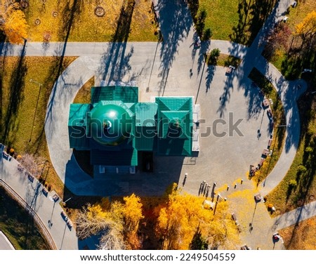 Aerial top vew of Church in the city, drone shot. Barnaul, Siberia, Russia. Beauty autumn day