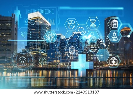 City view panorama of Boston Harbor and Seaport Blvd at night time, Massachusetts. Financial downtown. Glowing healthcare digital medicine icons. The concept of disease treatment, threat of pandemic