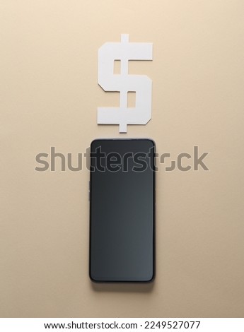 Smartphone and dollar currency symbol on beige background
