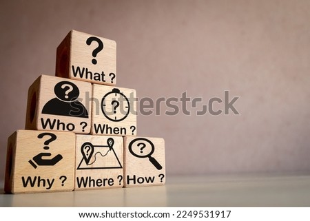 5W1H Root cause analysis concept.,What, When, Why, Who, Where, and How written on wooden cubes rranged in pyramid shapes with copyspace use for questions, problem-solving,and decision making idea. Royalty-Free Stock Photo #2249531917