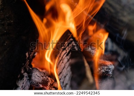 Burning bonfires and warm temperatures.