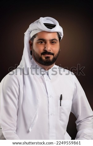 Doha, Qatar - January 14, 2023: Arab Man in Qatari Dress posing in studio. Corporate head shot