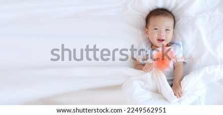 Asian infant baby with line of heart organ for heart health of children concept, Coronary Artery Disease, Congenital Heart Defect awareness week in 7-14 February campaign Royalty-Free Stock Photo #2249562951