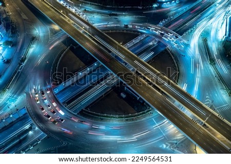 Expressway top view, Road traffic an important infrastructure, Drone aerial view fly in circle, traffic transportation, Public transport or commuter city life concept of economic and energ, transport. Royalty-Free Stock Photo #2249564531
