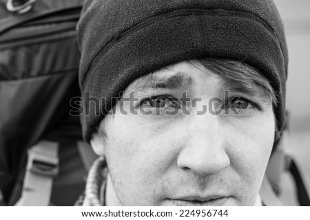 Image of a young man looking into the camera at Shetland Islands. Sharp Image with focus on eyes