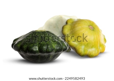 Three fresh different pattypan squashes on white background Royalty-Free Stock Photo #2249582493
