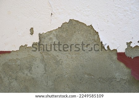 cement wall background with peeling paint